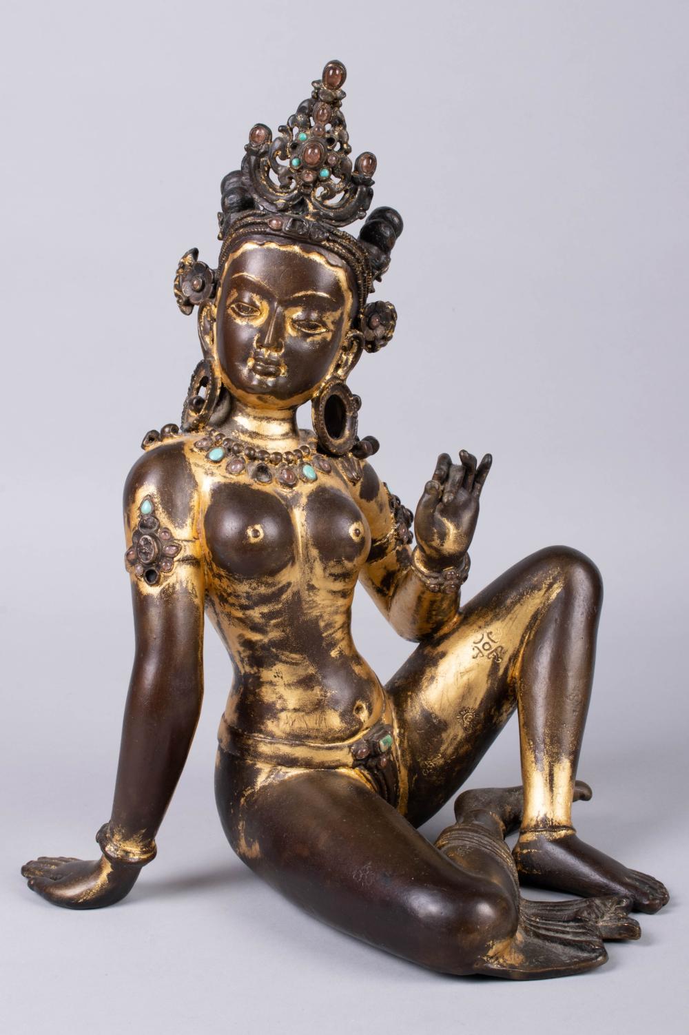 Appraisal: SINO-TIBETAN PARCEL-GILT BRONZE FIGURE OF AVALOKETSVARA the deity seated with