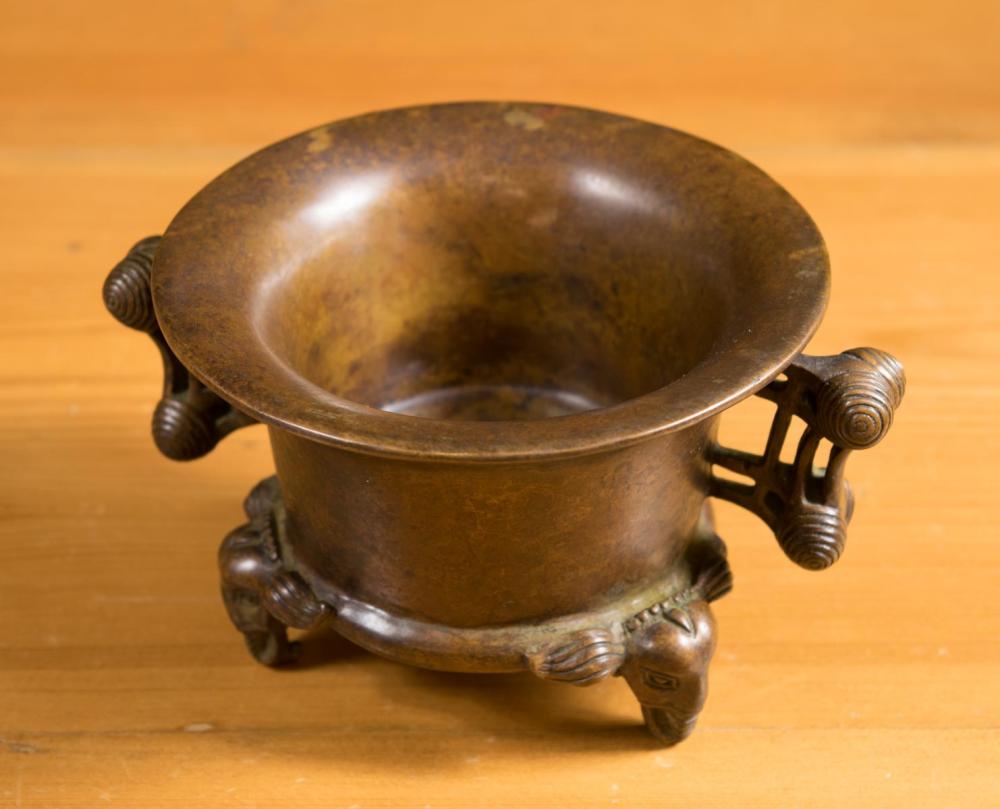 Appraisal: CHINESE BRONZE CENSER of low profile circular form with stylized