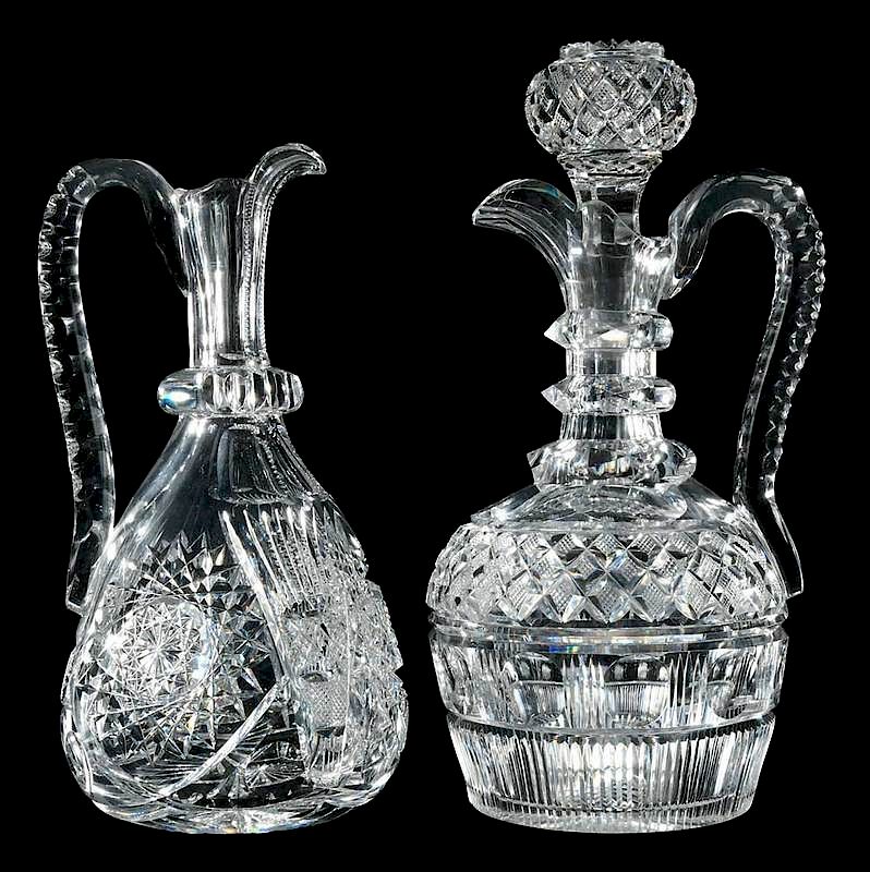 Appraisal: Two Handled Cut Glass Decanters one ring neck ewer with