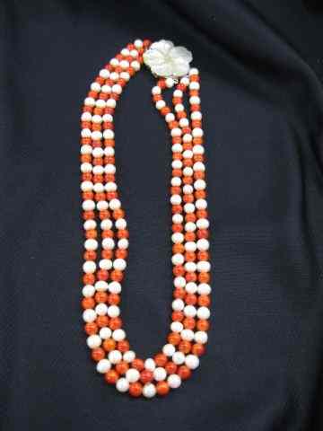 Appraisal: Coral Pearl Necklace triple strand mm beads carved abalone leaf