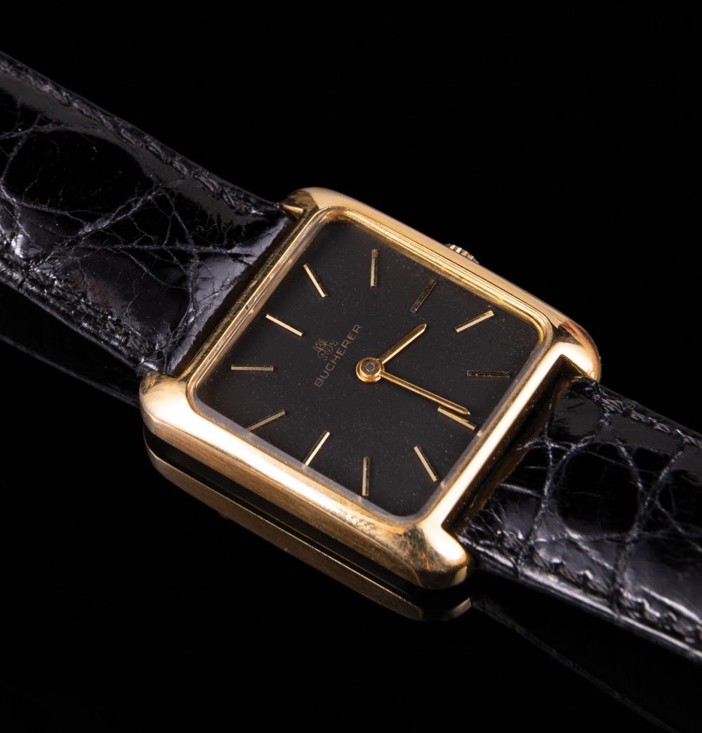 Appraisal: kt Yellow Gold Bucherer Wristwatch rectangular case black face stick