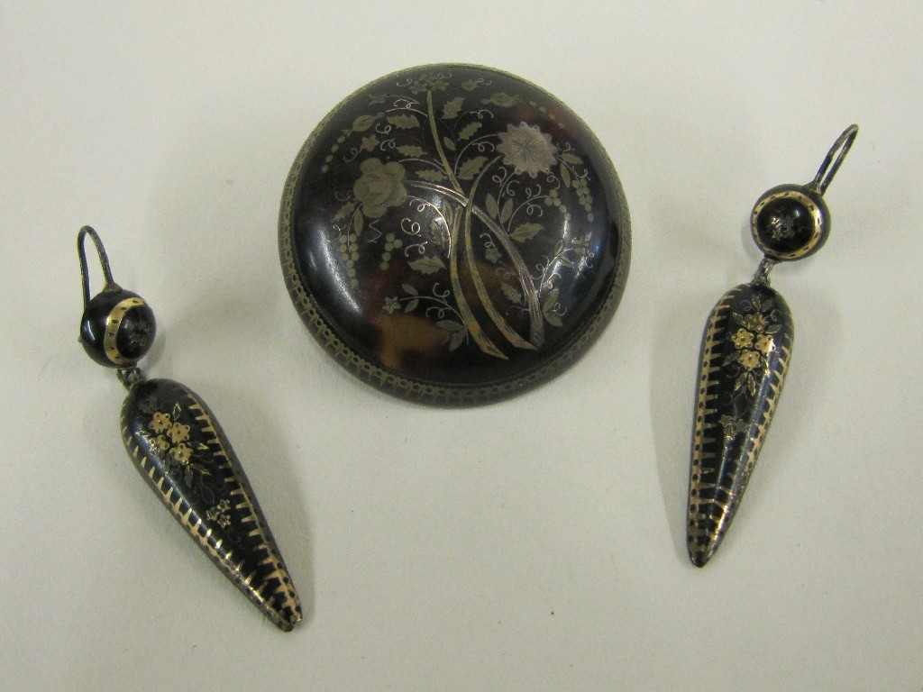 Appraisal: Tortoishell brooch of dome form with gold and silver floral