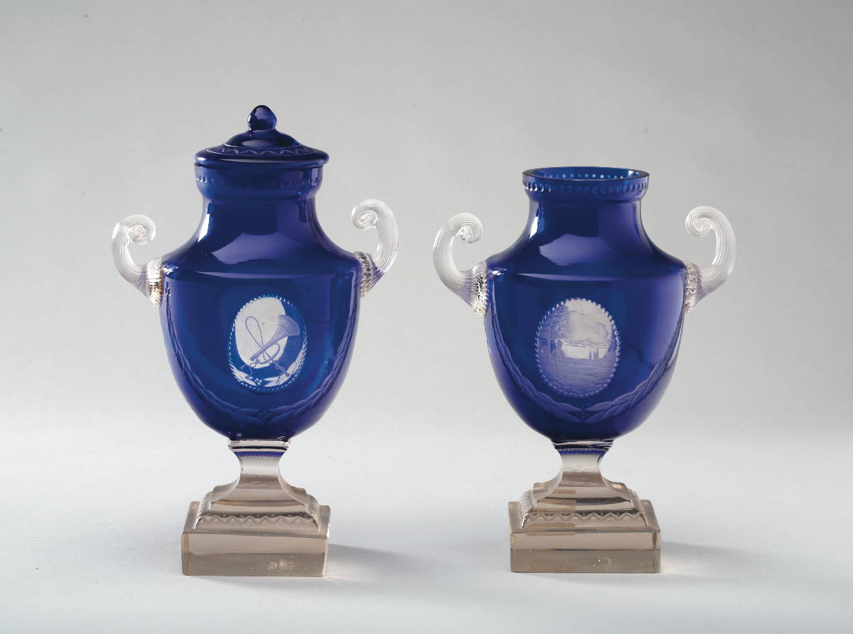 Appraisal: PAIR OF SWEDISH BLUE AND COLORLESS GLASS URNS WITH ENGRAVED