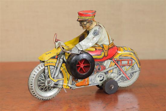 Appraisal: TIN WIND UP TOY A lithographed Marx Rookie Cop wind