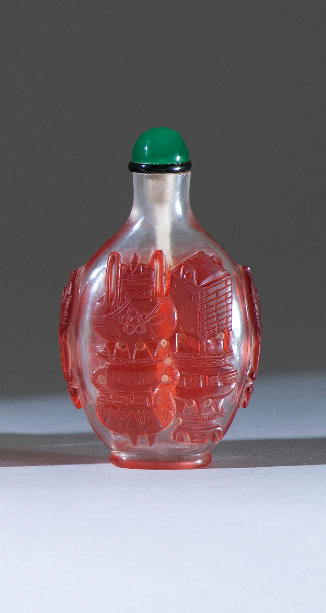 Appraisal: OVERLAY GLASS SNUFF BOTTLE th CenturyIn elongated ovoid form with