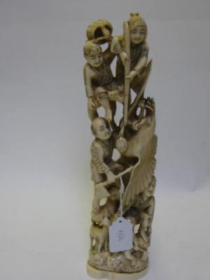 Appraisal: A JAPANESE CARVED IVORY OKIMONO Meiji Period depicting four men