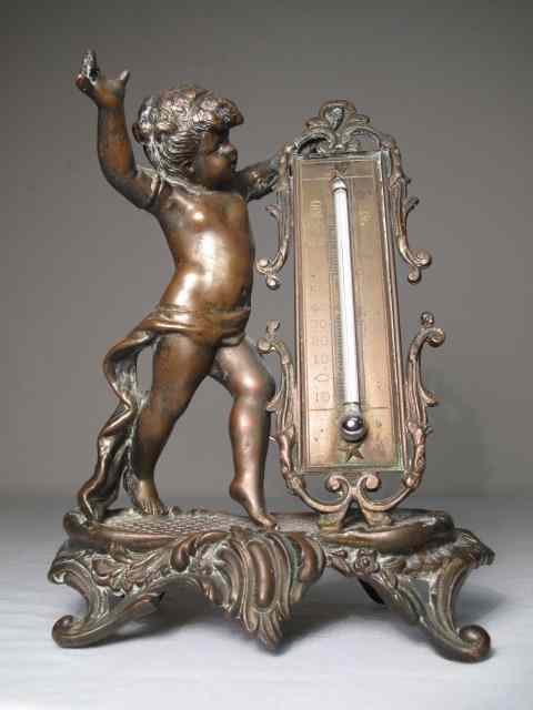 Appraisal: Vintage Victorian cherub desk thermometer Made of spelter Cherub figural