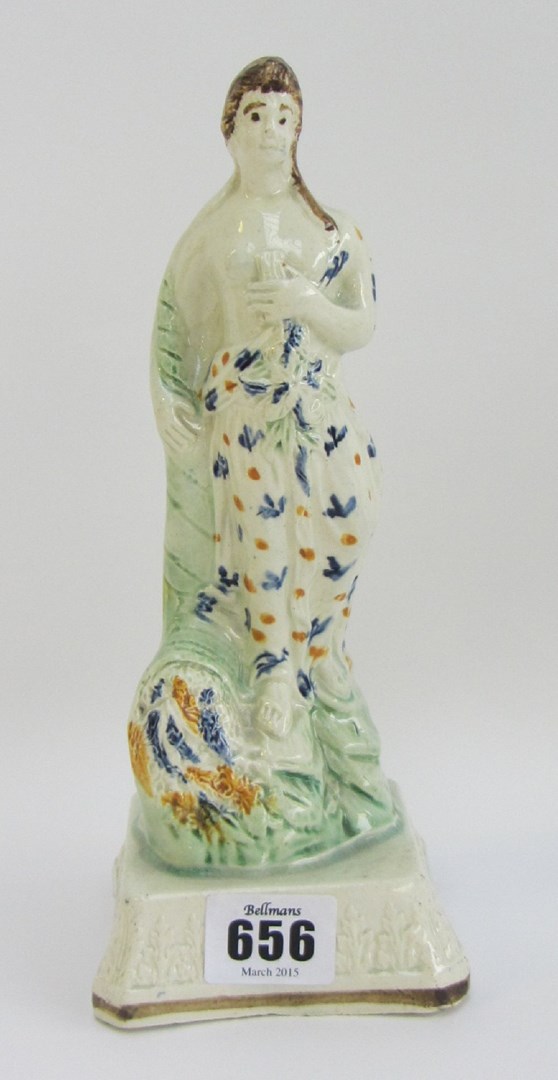 Appraisal: A Pratt ware figure of Spring' circa modelled as a