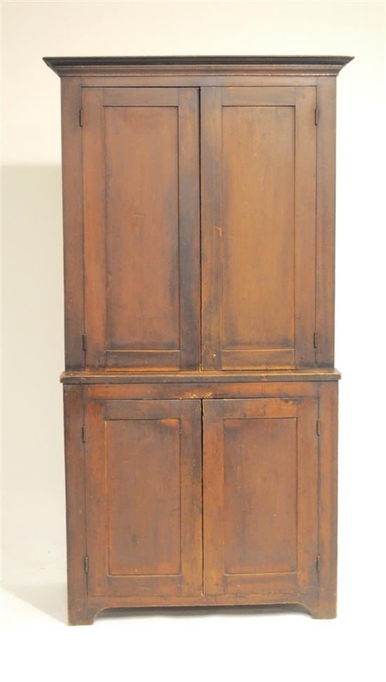 Appraisal: Pine standing cabinet th C projecting cornice over panelled doors