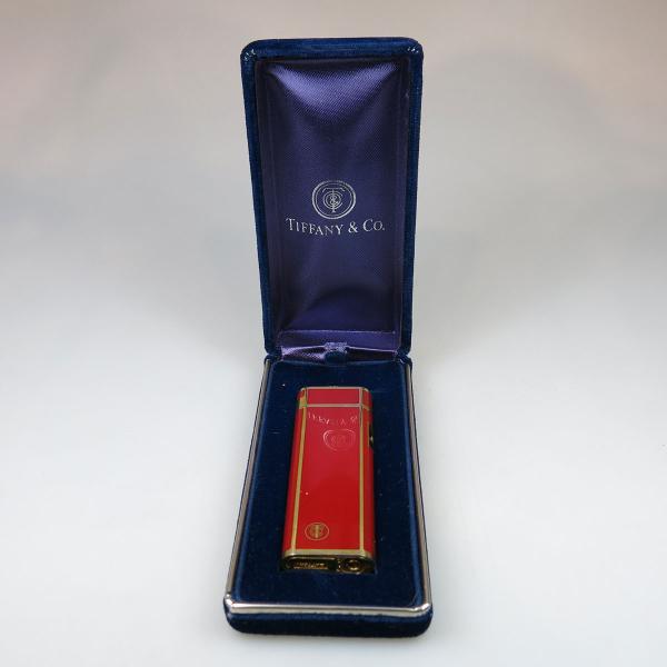 Appraisal: Tiffany Co Electronic Lighter in gold tone metal and red