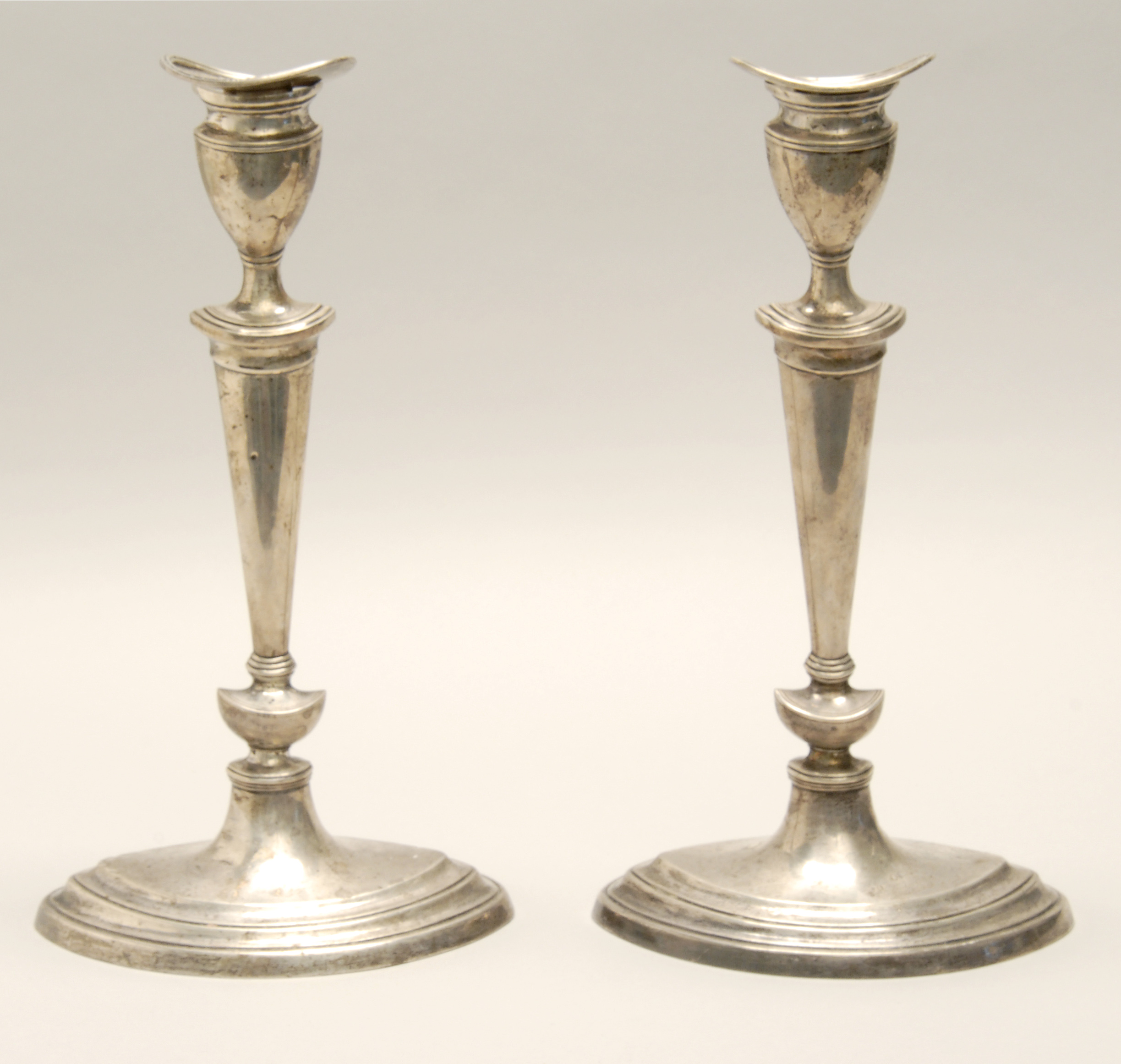 Appraisal: PAIR OF ENGLISH SILVER WEIGHTED CANDLESTICKS Sheffield - In oval