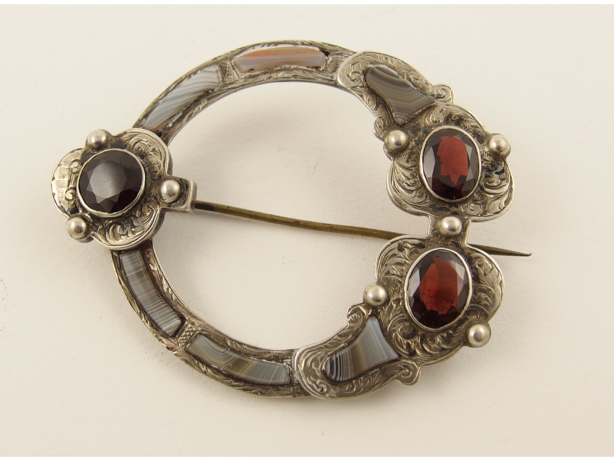 Appraisal: A Scottish agate and garnet set sash brooch