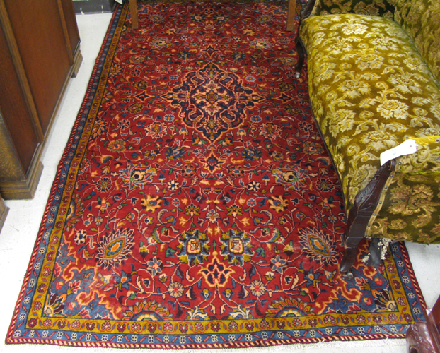 Appraisal: PERSIAN AREA RUG floral and central floral medallion design on