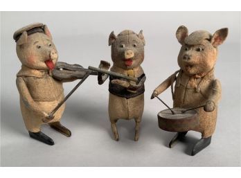 Appraisal: Three Schuco wind up toys of three pigs as musicians