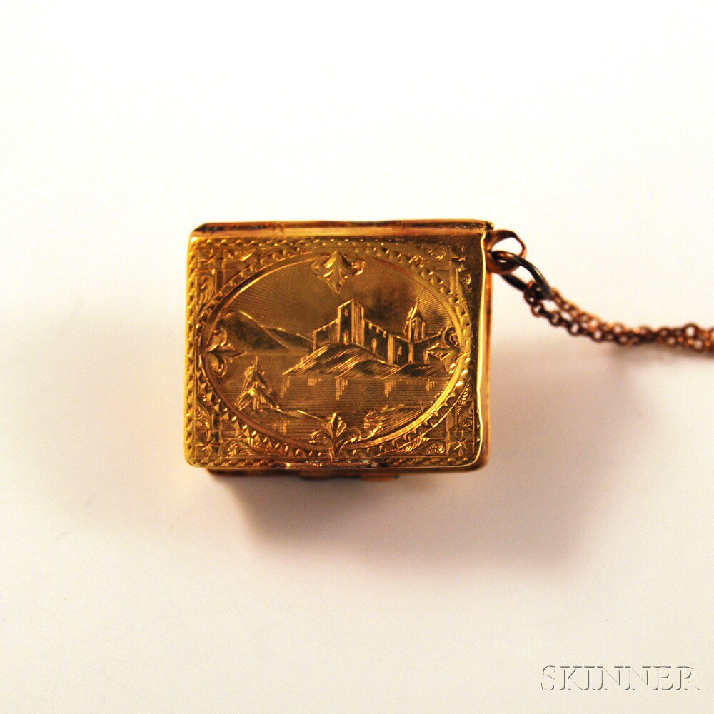 Appraisal: kt Gold Book-form Double Locket with Landscape Decoration the front