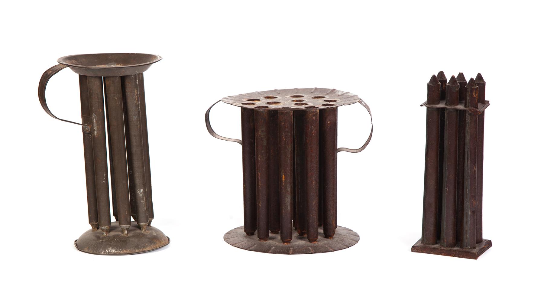 Appraisal: THREE TIN CANDLE MOLDS American mid th century Round thirteen-tube