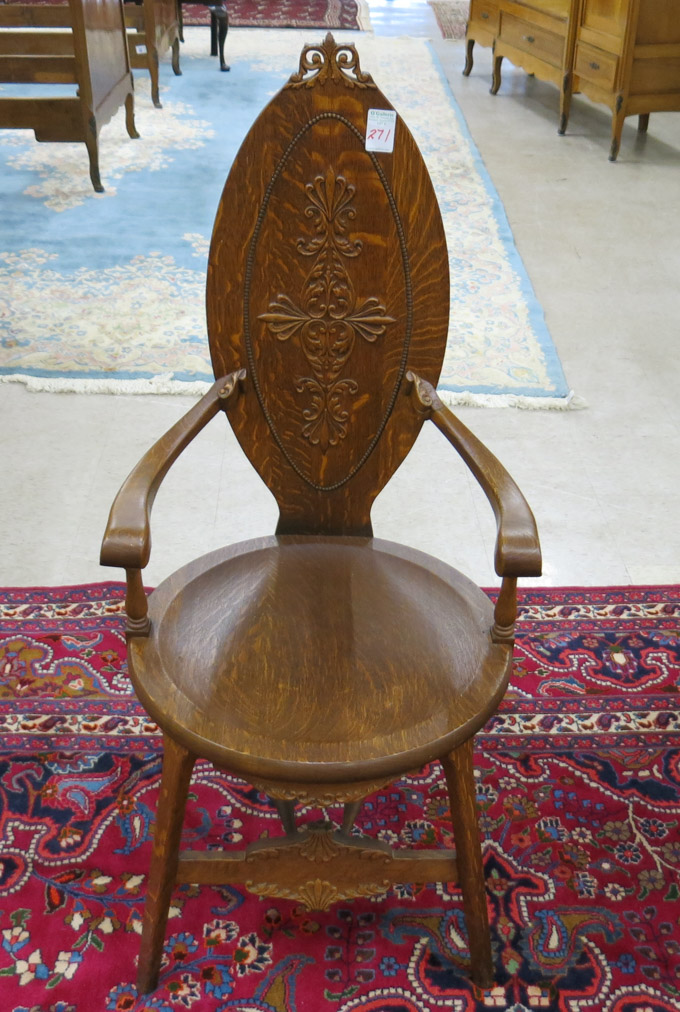 Appraisal: CARVED OAK MEDALLION-BACK ARMCHAIR American c having a round oak