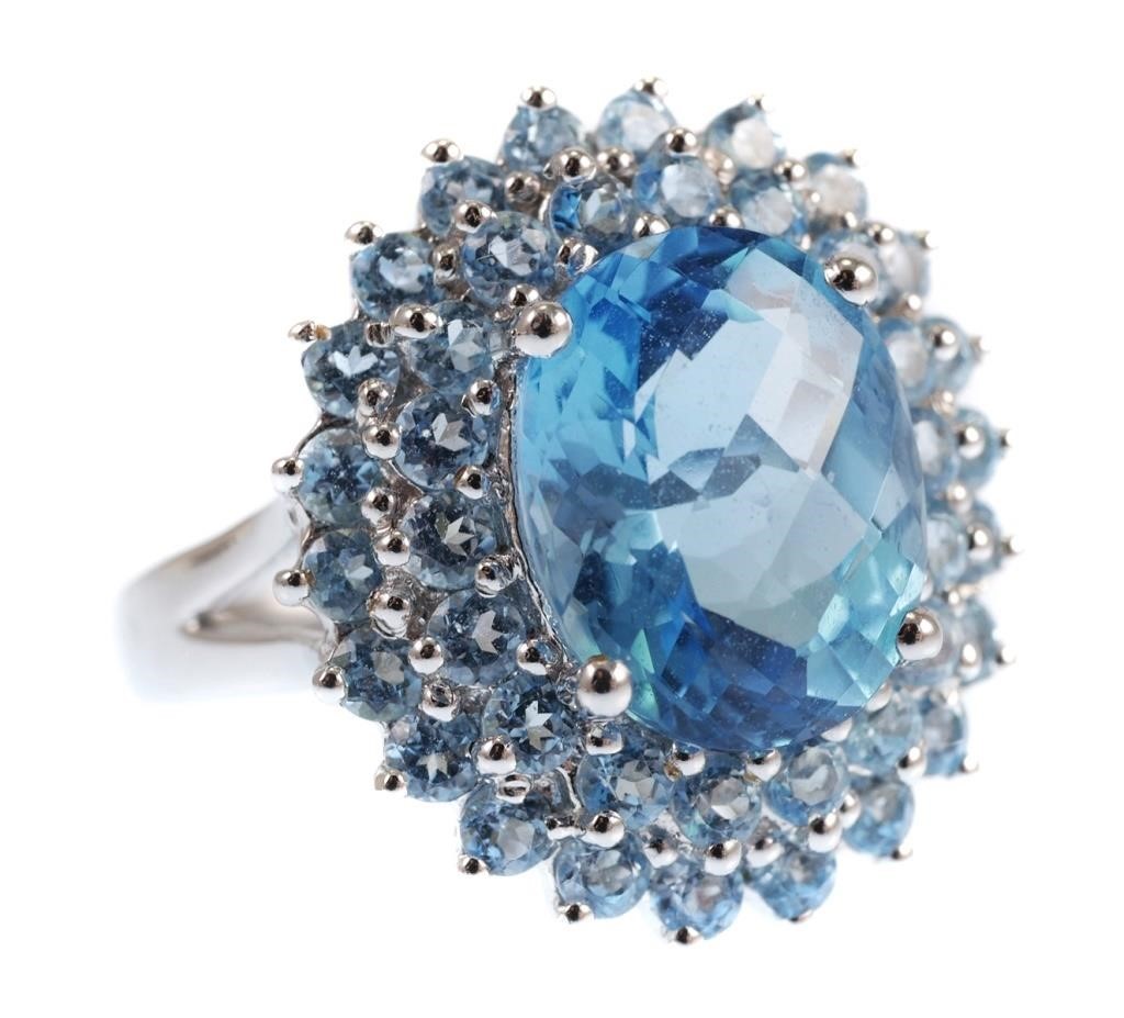 Appraisal: K white gold ring contains one faceted Swiss blue topaz