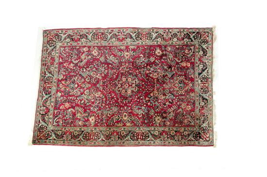 Appraisal: ORIENTAL RUG Ca Sarouk All over floral field on burgundy