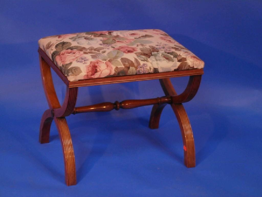 Appraisal: A reproduction mahogany stool raised on X framed supports united