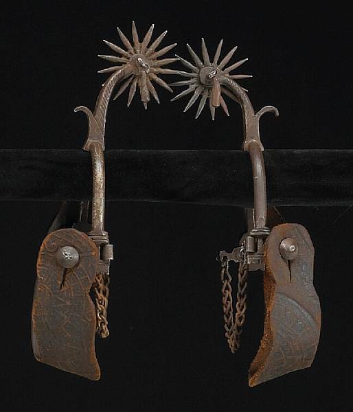 Appraisal: A pair of drop shank spurs in the Spanish Colonial