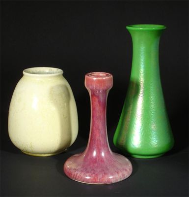 Appraisal: A Ruskin Pottery green lustre vase a souffle glaze candlestick