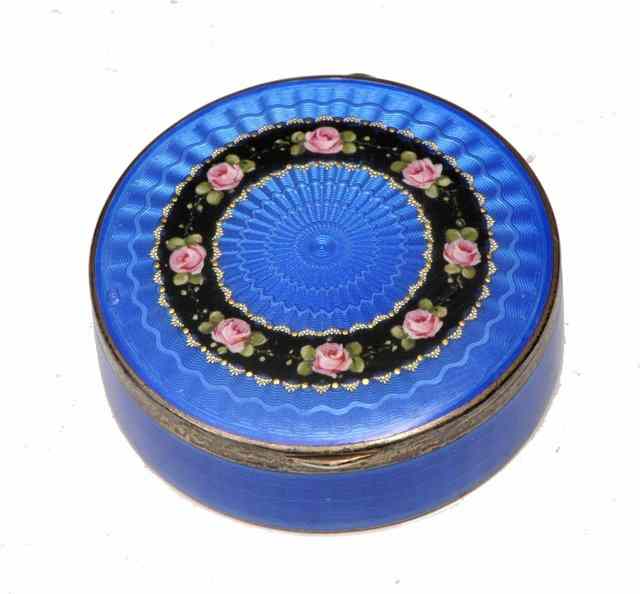 Appraisal: A CONTINENTAL SILVER AND ENAMEL CIRCULAR BOX with engine turned