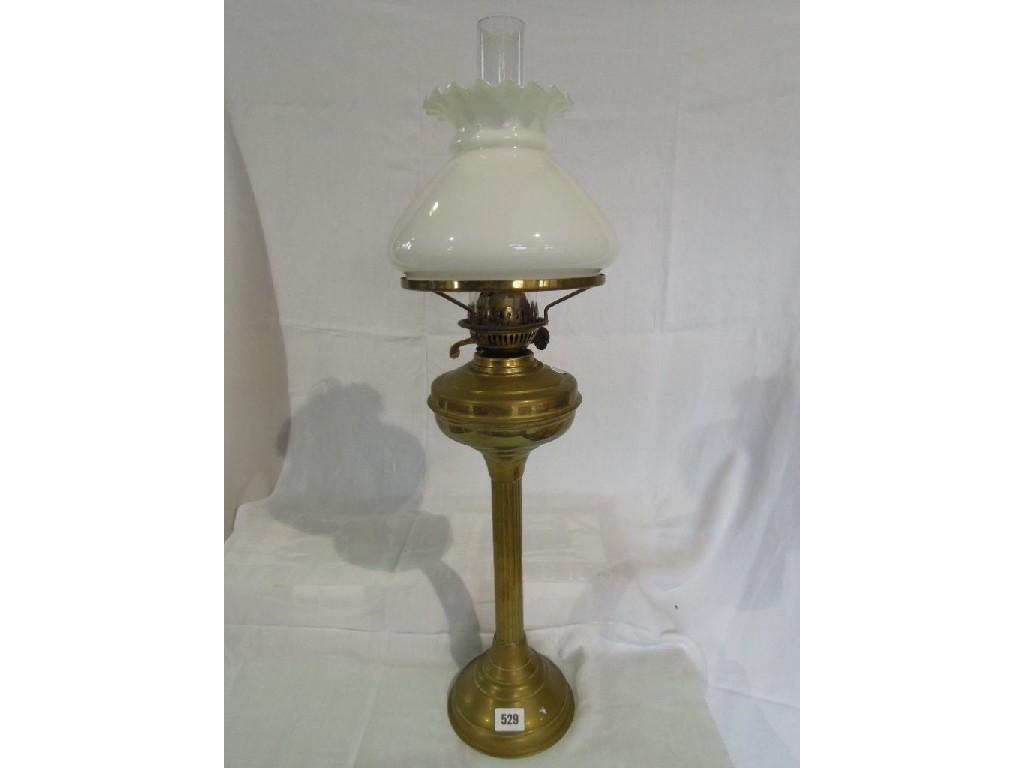 Appraisal: A brass oil lamp on reeded column support with a