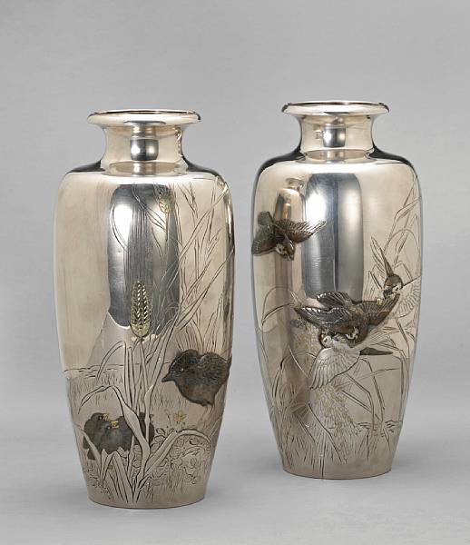 Appraisal: A pair of silver presentations vases with mixed metal accents