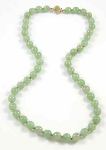 Appraisal: JADE AND FOURTEEN KARAT GOLD NECKLACE strung with green jade