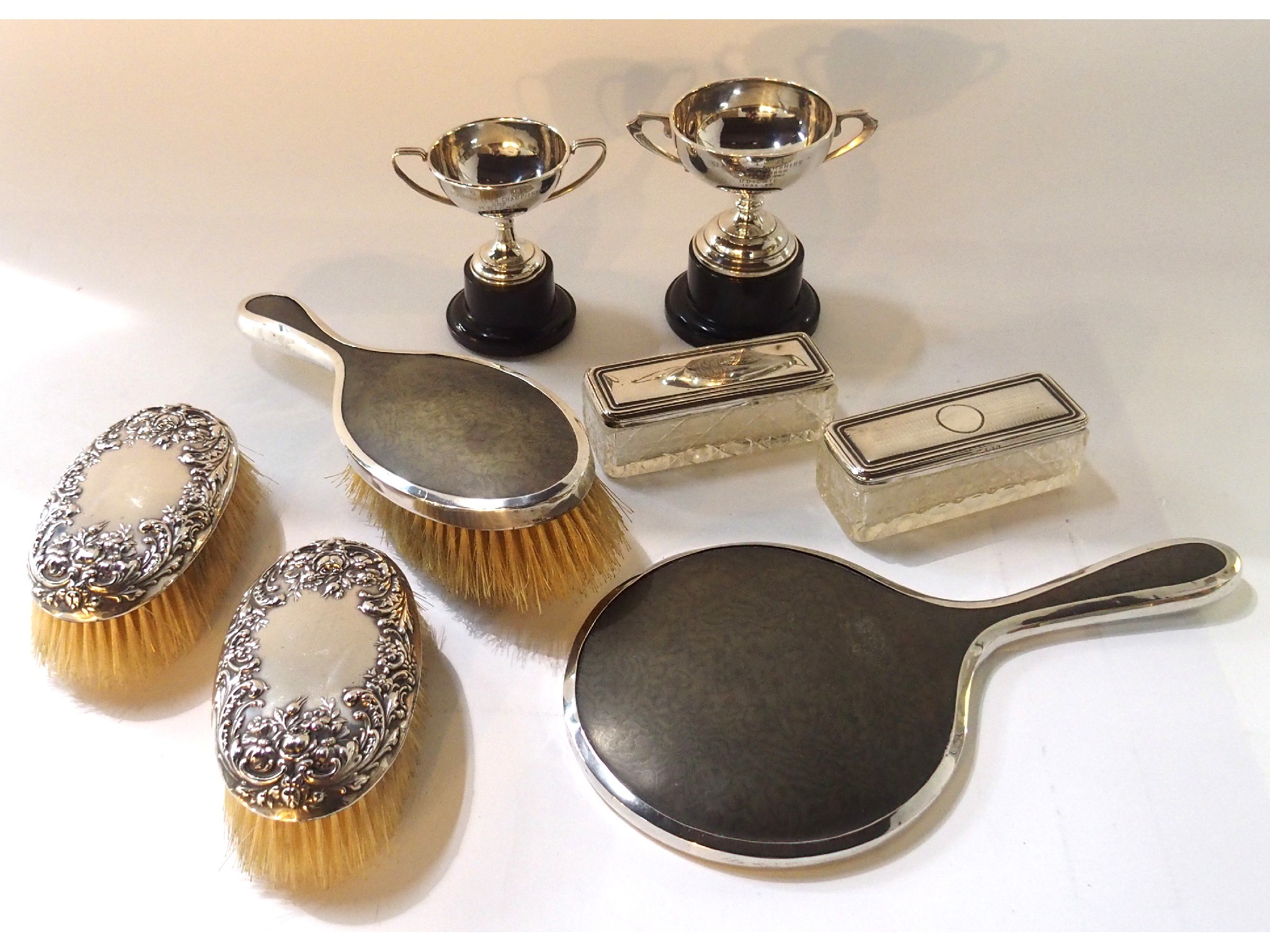 Appraisal: A lot comprising two silver trophy cups a silver dressing