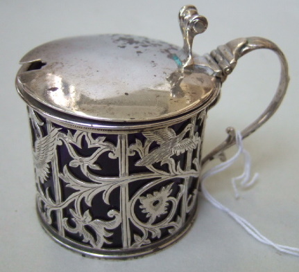 Appraisal: A silver hinge lidded mustard pot the body pierced with