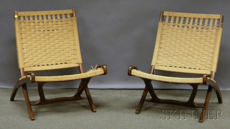 Appraisal: Two Hans Wegner-style Modern Folding Wood Lounge Chairs with Woven