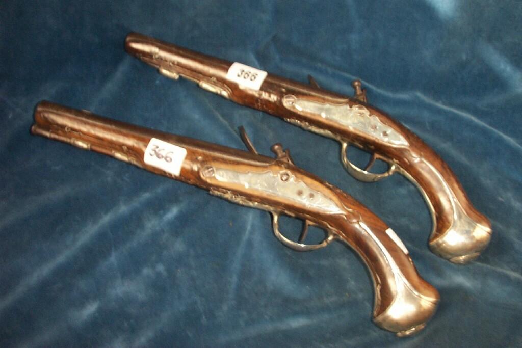 Appraisal: A pair of th century walnut flint lock pistols with