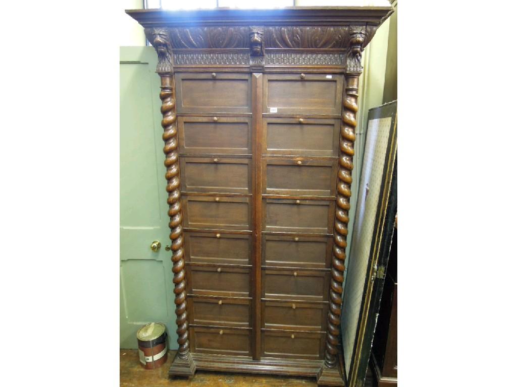 Appraisal: A substantial Victorian oak Wellington style chest with carved lions