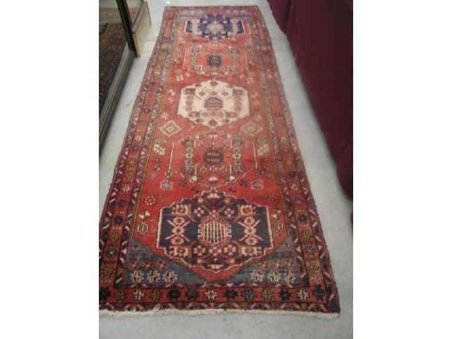 Appraisal: Heriz Persian Handmade Runner medallions on red field floral geometric