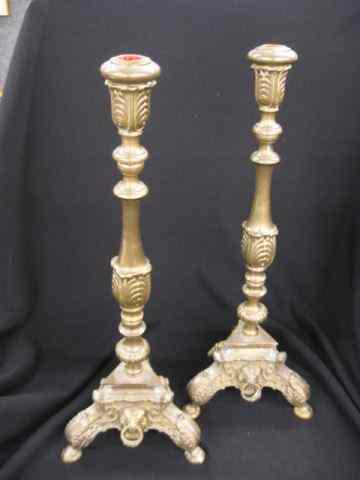 Appraisal: Pair of Brass Candlesticks fancy triangular base with lion's head