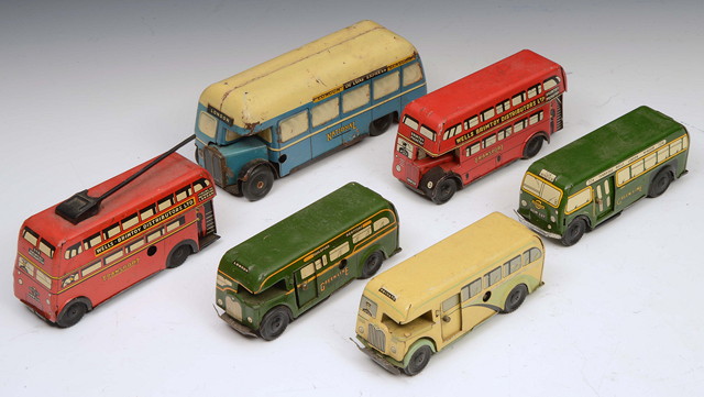 Appraisal: THREE SIMILAR CLOCKWORK COACHES together with a Brim toy tram