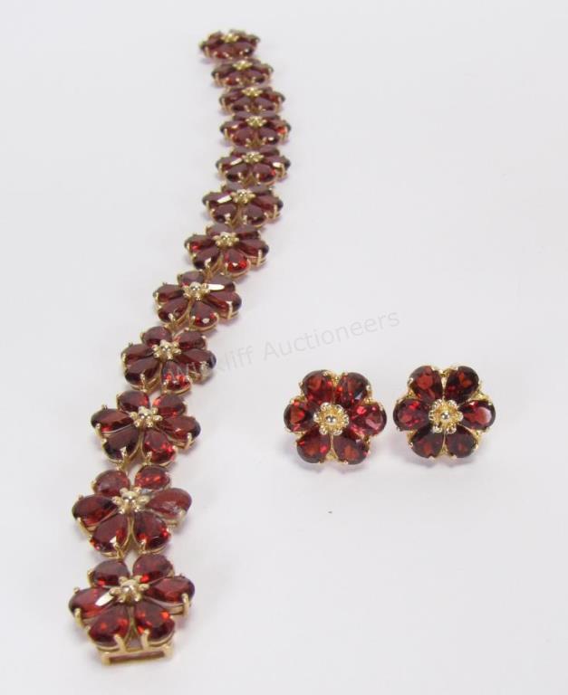 Appraisal: A K yellow gold garnet flower link bracelet with matching