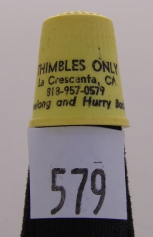 Appraisal: Yellow plastic advertising thimble THIMBLES ONLY 'sewlong and hurry back'