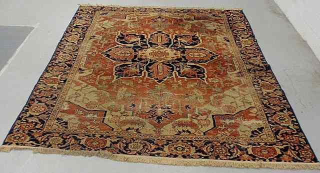 Appraisal: Antique room size Serapi oriental carpet tomato red field and