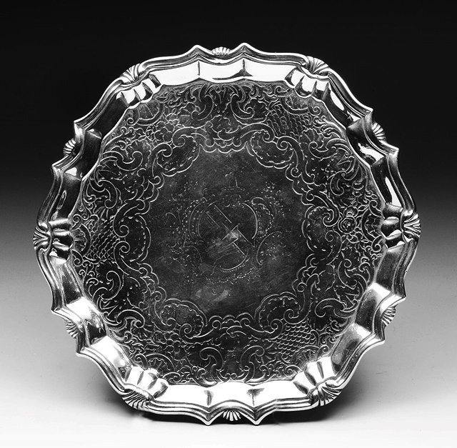 Appraisal: A GEORGE II SILVER SALVER with shell and shaped border