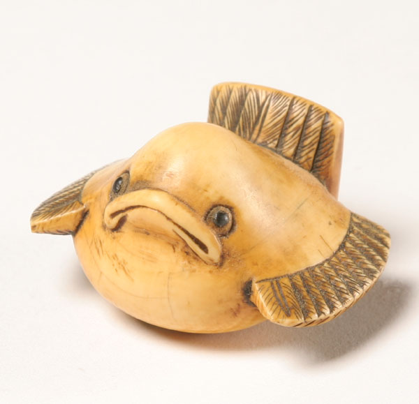 Appraisal: Japanese carved ivory bird netsuke with glass eyes W The