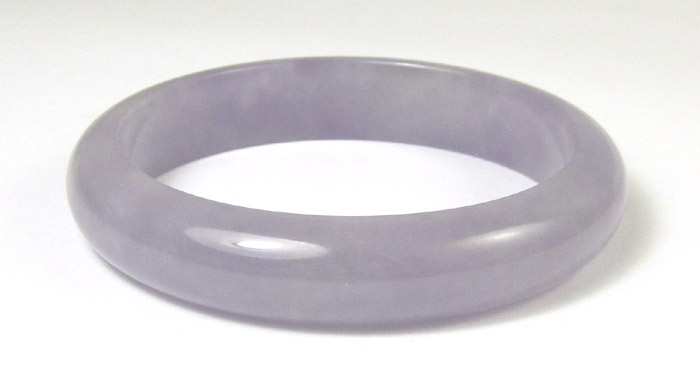 Appraisal: LAVENDER JADE BANGLE weighing grams and measuring inches in diameter