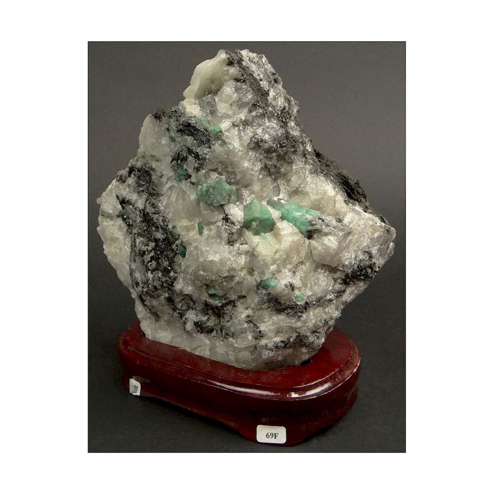 Appraisal: Mineral Specimen with Emeralds Mounted on Wooden Base Measures -