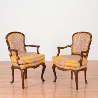 Appraisal: Near pair Italian Rococo carved walnut armchairs th th c