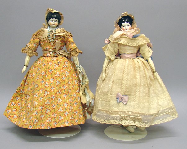 Appraisal: Pair of china Lowbrow dolls Black hair handmade cloth bodies