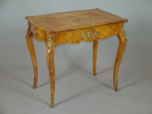 Appraisal: A Louis XV style burr walnut marquetry centre table the