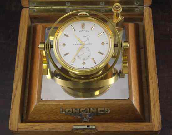 Appraisal: A Longines gilt brass desk chronometer in a golden oak