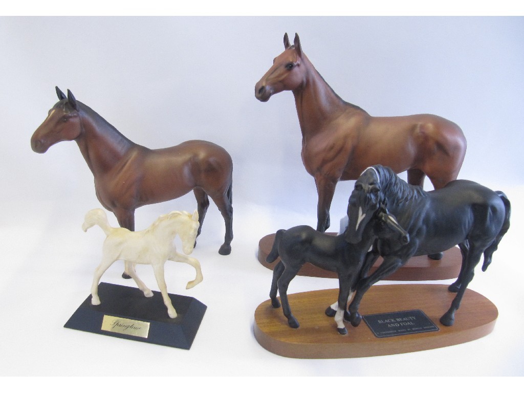 Appraisal: Four Beswick horses including Arkle on base Black Beauty and